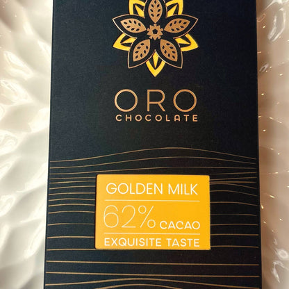 Close-up of the Oro Golden Milk 62% cacao chocolate bar label and the gold Oro flower mark on the black pack