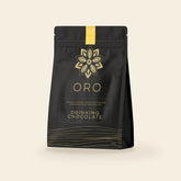 Oro Golden Milk Chai drinking chocolate, 12oz pouch, on a cream background