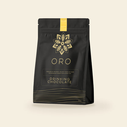 Oro Golden Milk Chai drinking chocolate, 12oz pouch, on a cream background