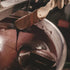 Stone-ground Nicaraguan chocolate ribboning off the spatula in the melangeur at Oro&