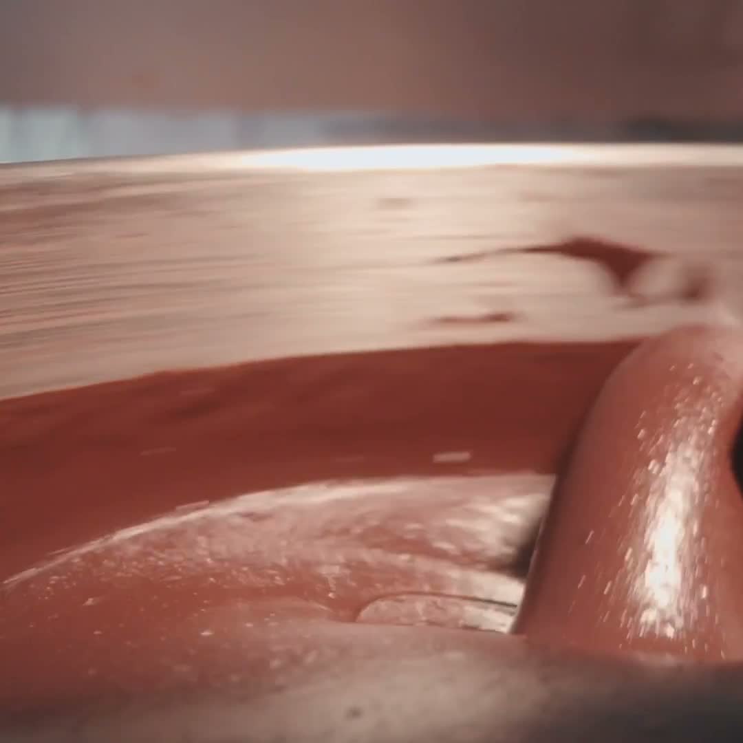 Chocolate moving through the stone melanger.
