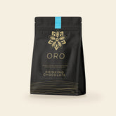 Oro Single Origin drinking chocolate, 12oz pouch, on a cream background