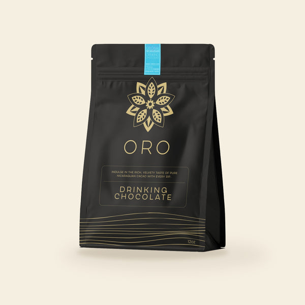 Oro Single Origin drinking chocolate, 12oz pouch, on a cream background